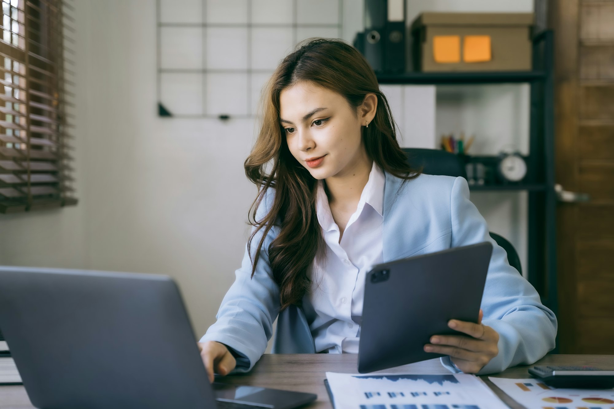 Business women working with laptop and digital tablet computer